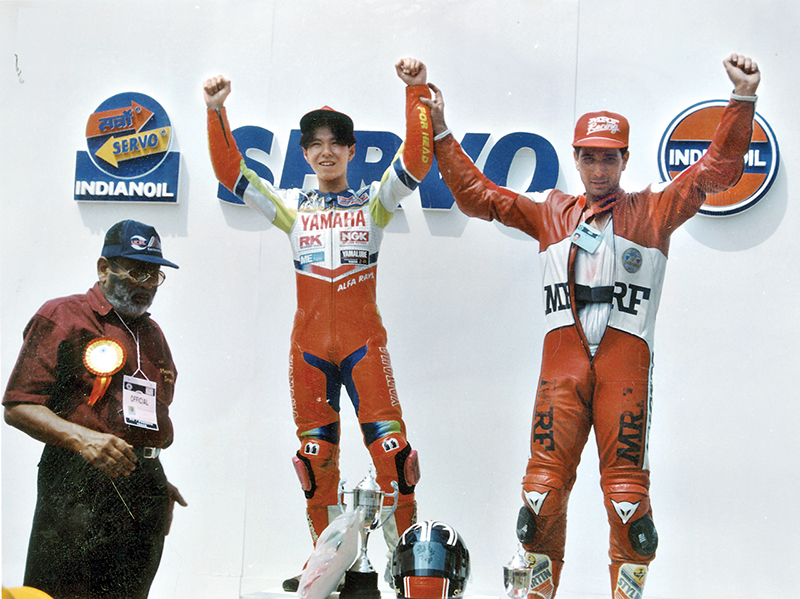 Aspi (Right) with former MotoGP rider Shinya Nakano (Left) celebrating on the podium after a race in India
