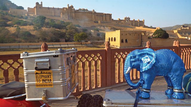 Three travellers set out from Berlin astride bright red Vespas to reach Goa in time for the full moon festival