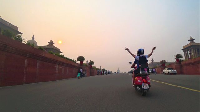Three travellers set out from Berlin astride bright red Vespas to reach Goa in time for the full moon festival