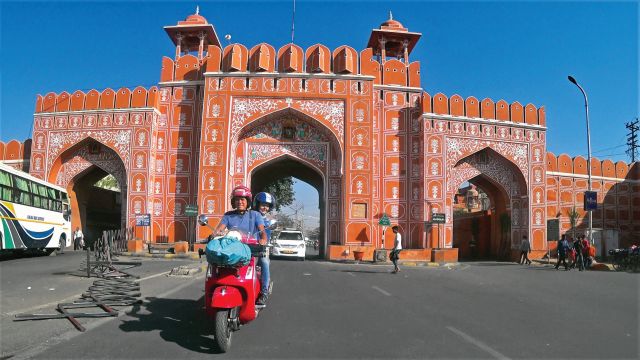 Three travellers set out from Berlin astride bright red Vespas to reach Goa in time for the full moon festival