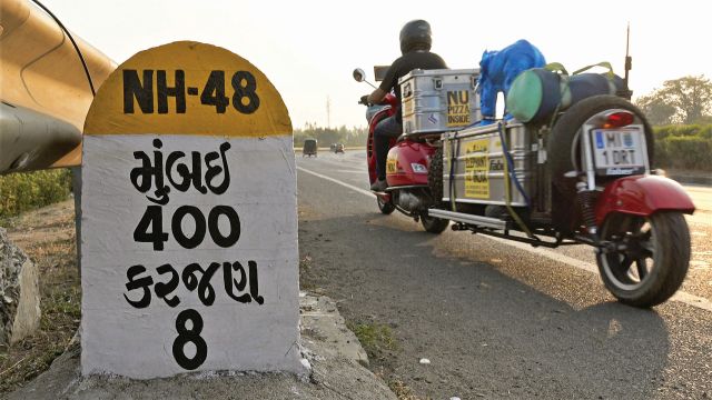 Three travellers set out from Berlin astride bright red Vespas to reach Goa in time for the full moon festival